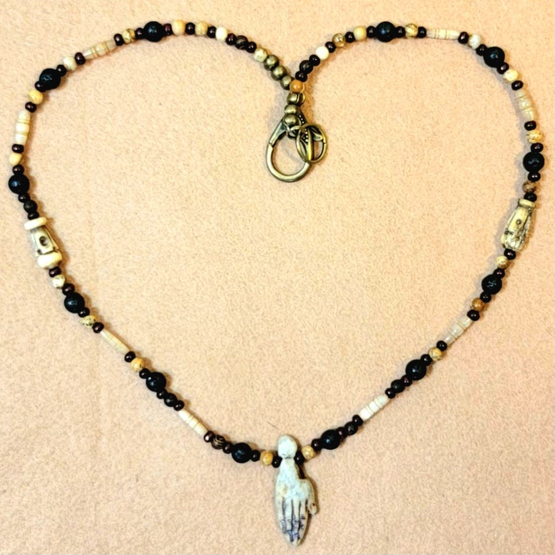 2 Hand pendant necklaces: Sold as a pair.