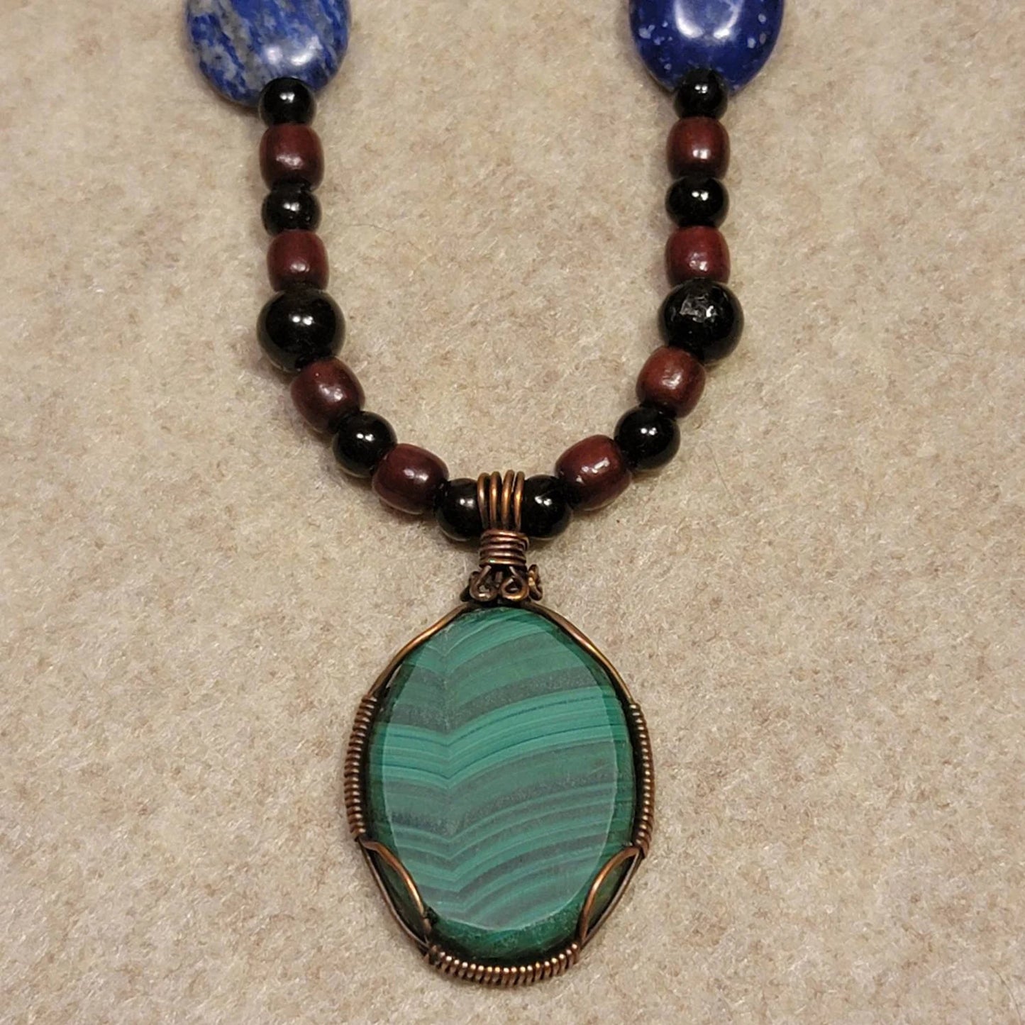 Gorgeous Malachite Cabachon pedant W/ Lapis Lazuli, Tourmaline, Mahogany, Carnelian and Bone beads