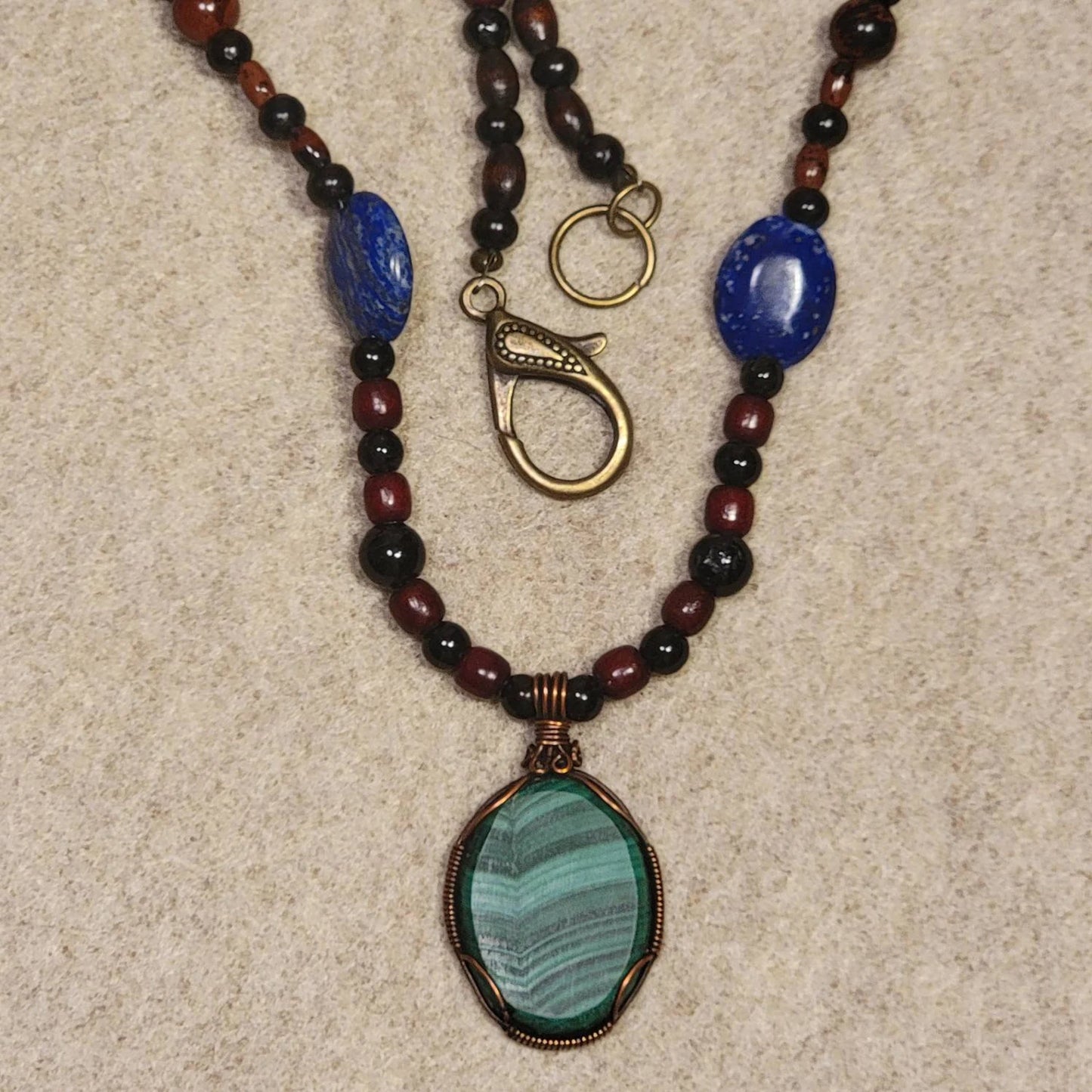 Gorgeous Malachite Cabachon pedant W/ Lapis Lazuli, Tourmaline, Mahogany, Carnelian and Bone beads