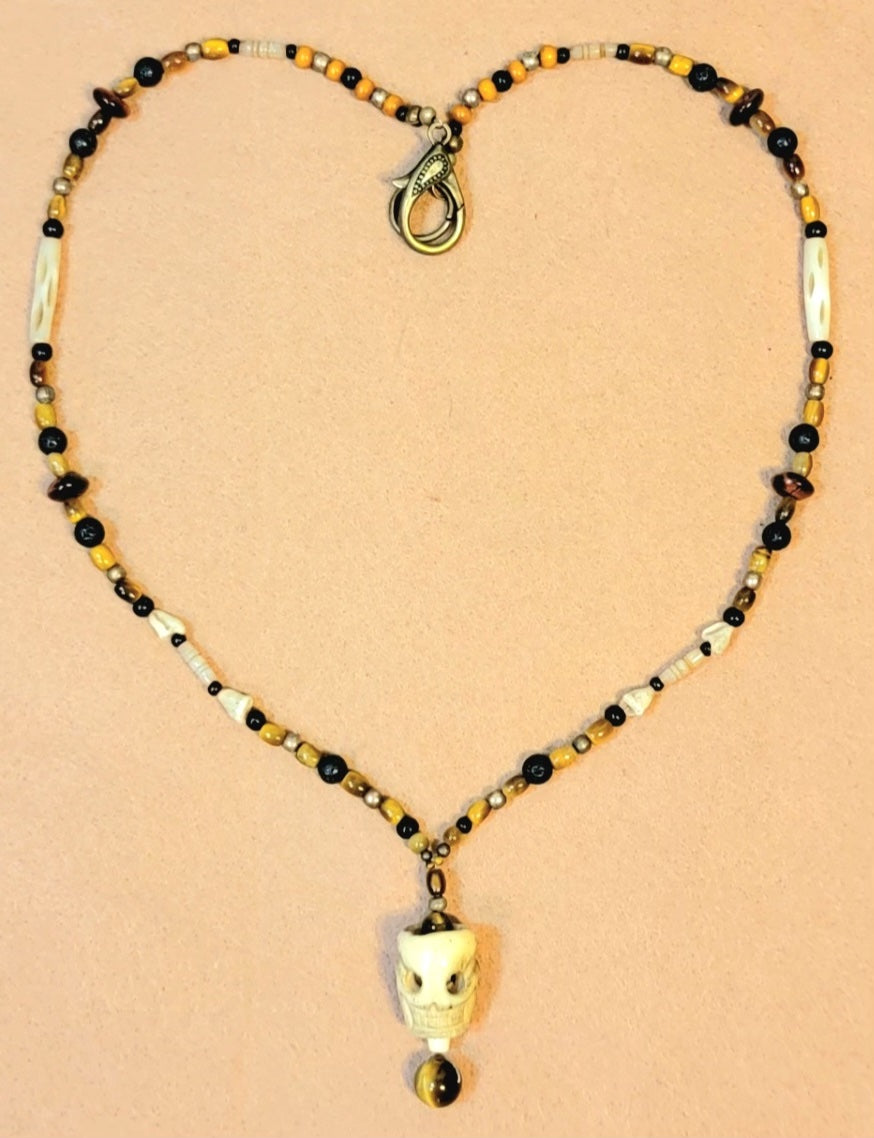 1 Skull Bone Drop Bead & Tiger Eye necklace, 1 Skull Bone Drop Bead & Turquoise necklace. Sold as a pair.