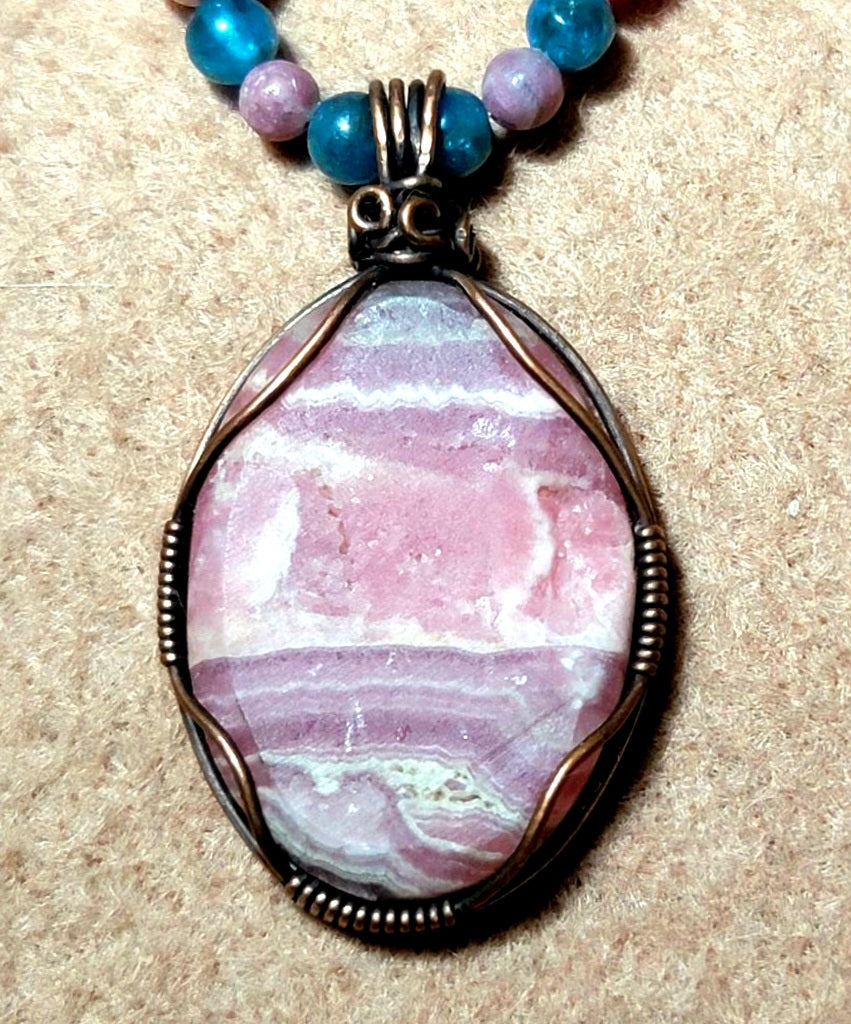 Rhodochrosite Cabochon:  Apatite, Pink Tourmaline, Rhodonite & Bone