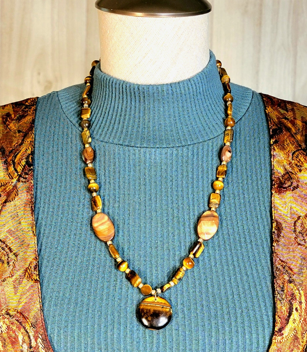 Tiger Eye Pendant:  Assorted cut & polished Tiger Eye