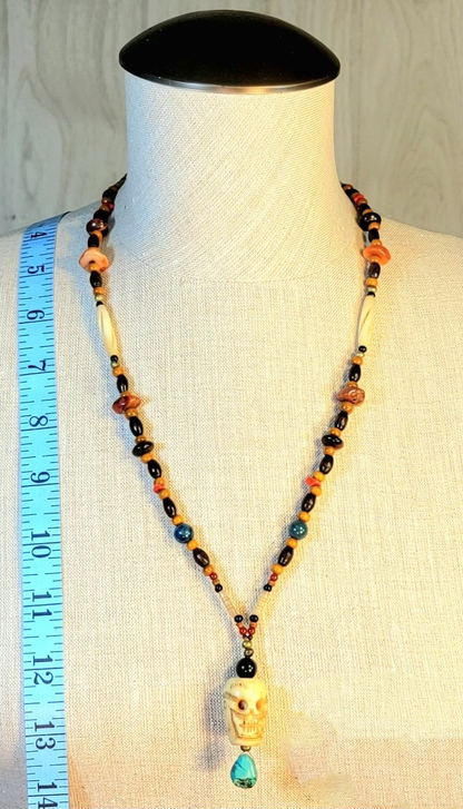 1 Skull Bone Drop Bead & Tiger Eye necklace, 1 Skull Bone Drop Bead & Turquoise necklace. Sold as a pair.
