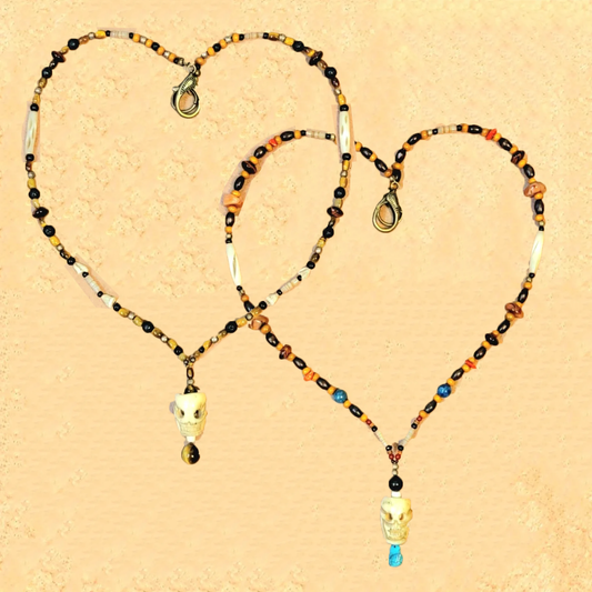 1 Skull Bone Drop Bead & Tiger Eye necklace, 1 Skull Bone Drop Bead & Turquoise necklace. Sold as a pair.