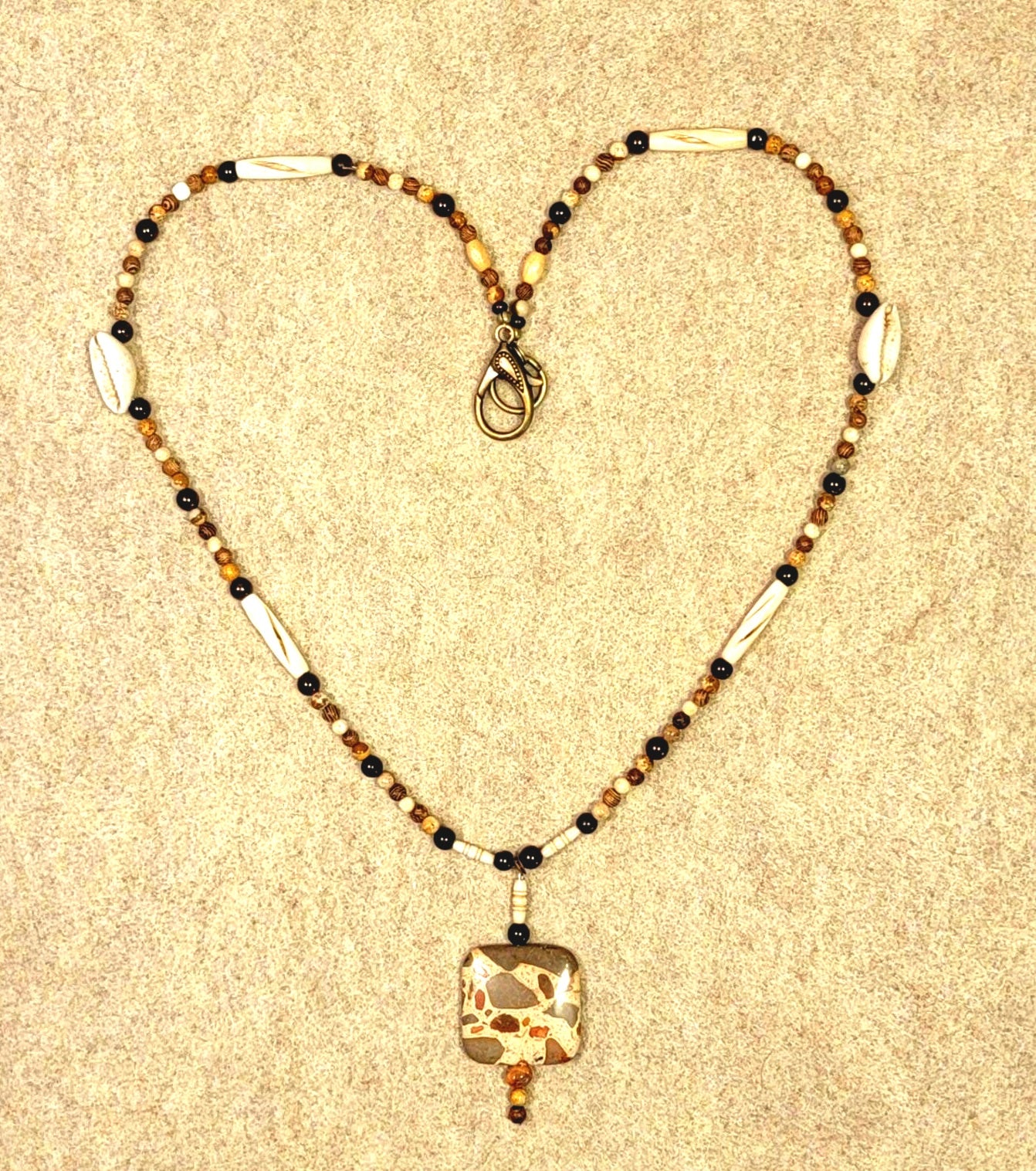 Safari Jasper Drop Bead: Garnet, Jasper, Bone, Shell & Seed. Creating an earthly balanced necklace.