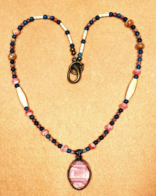 Rhodochrosite Cabochon:  Apatite, Pink Tourmaline, Rhodonite & Bone