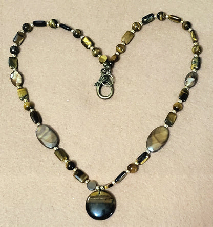 Tiger Eye Pendant:  Assorted cut & polished Tiger Eye