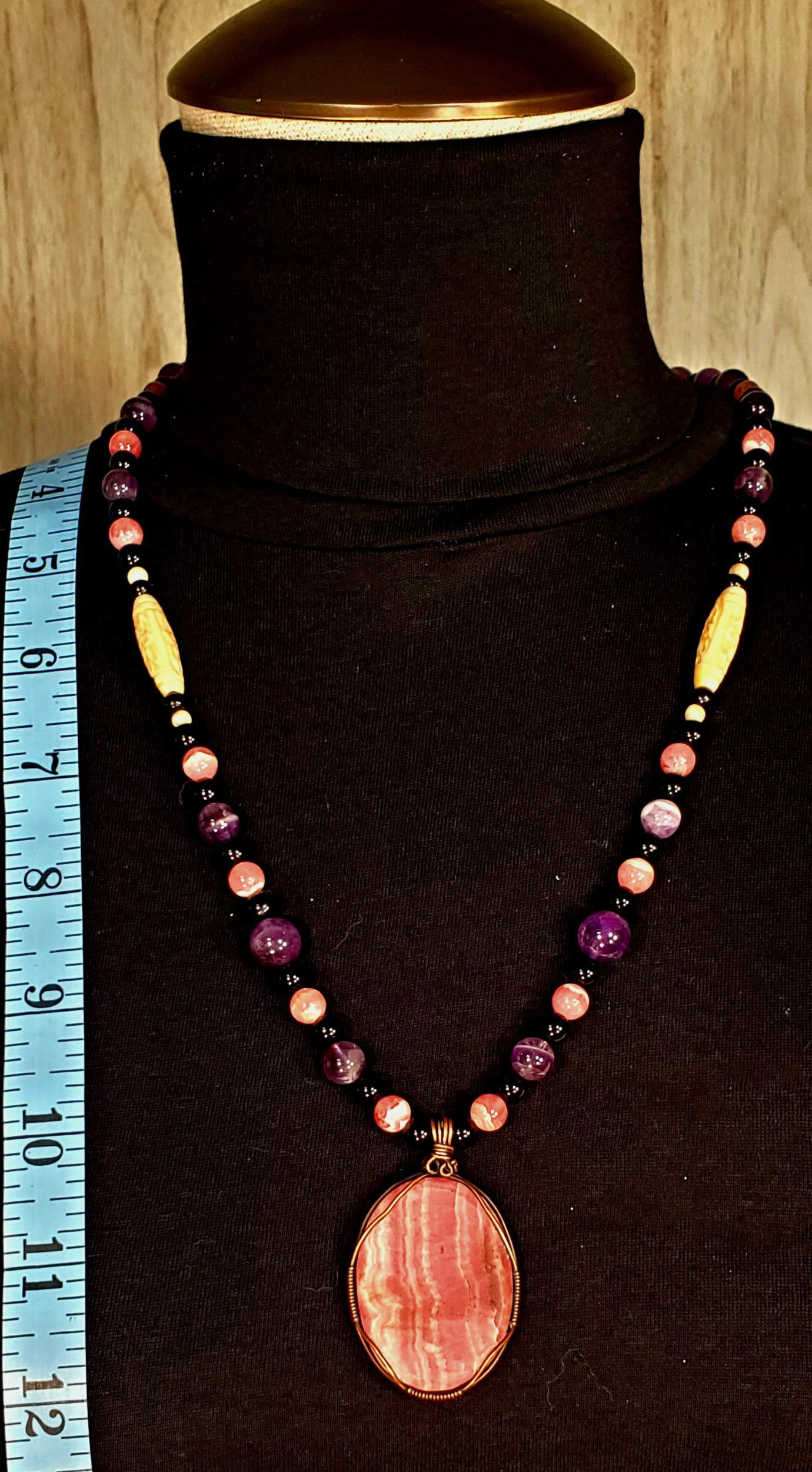 Rhodochrosite Cabochon:  Black Tourmaline, Chevron Amethyst, Rhodalite, Amethyst, Bone & Seed            & seed