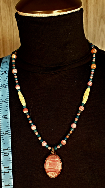 Rhodochrosite Cabochon:  Apatite, Pink Tourmaline, Rhodonite & Bone