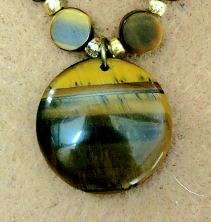 Tiger Eye Pendant:  Assorted cut & polished Tiger Eye