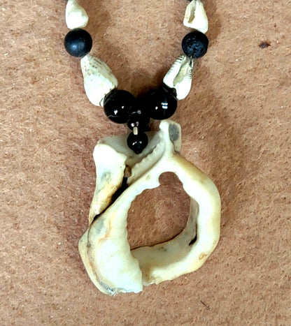 Shell Pendant: Oyster Shell, Bone, Shell & Lava  Elegantly connecting ones heart chakra to the external through the portal center of the shell.