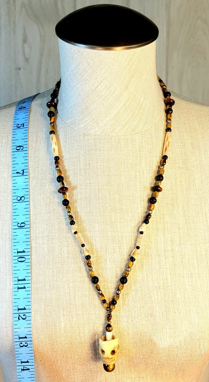 1 Skull Bone Drop Bead & Tiger Eye necklace, 1 Skull Bone Drop Bead & Turquoise necklace. Sold as a pair.