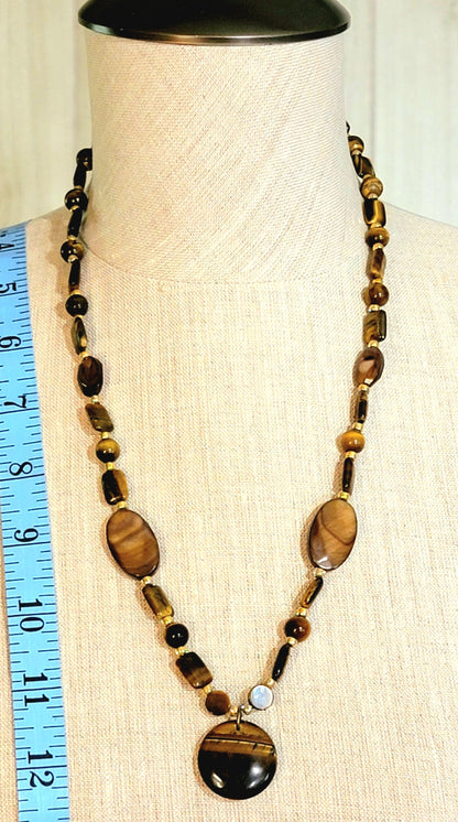 Tiger Eye Pendant:  Assorted cut & polished Tiger Eye